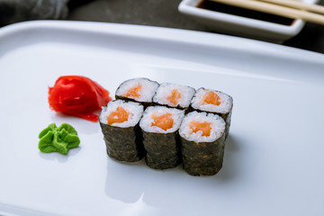 salmon roll on black concrete table