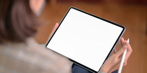 Businesswoman holding blank screen tablet