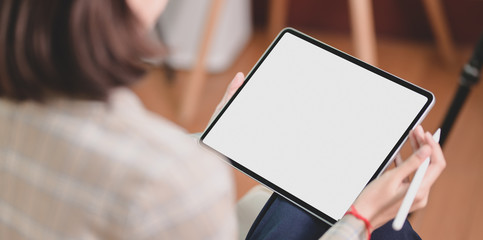 Businesswoman holding blank screen tablet