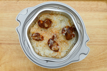 top view raw self cooking fast food of rice with sausage slices