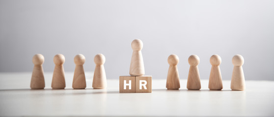 Wooden human figure on the cubes. Human Resources
