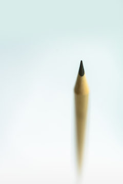 Very shallow close-up image of the pencil tip There is a blurred image around and there is a copy space.