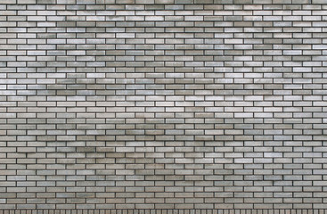 Old grey brick wall texture background. Tiled.