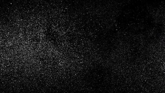 Particle dust cloud dynamically floating with turbulent wind on black background  