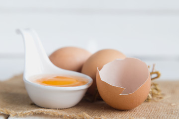 Eggs chicken on white wood background