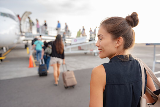 Boarding Plane Outside On Tarmac Asian Woman Tourist Walking Up To Airplane Leaving For Business Trip.