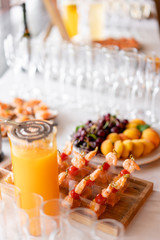 Delicious shrimp and sliced tomatoes. Tasty buffet table. Catering concept