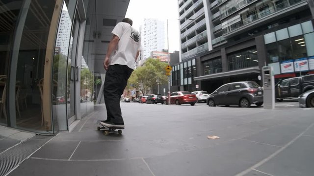 Skateboarding downtown Melbourne CBD bollards slow motion