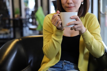 Woman drinking coffee with copy space