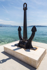 Kastel Stari, big ancient anchor on the shore