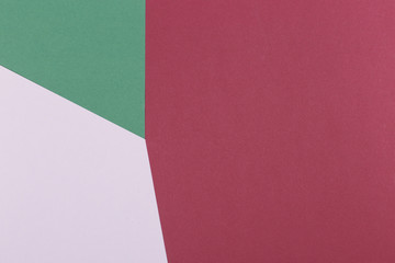 Paper green, burgundy, white empty background, geometrically located. Color blank for presentations, copy space.