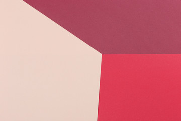Paper light beige, burgundy, red empty background, geometrically located. Color blank for presentations, copy space.