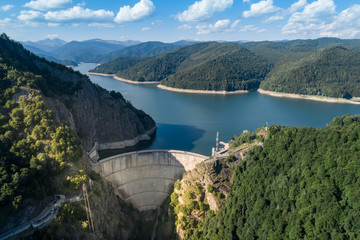 Obraz na płótnie Canvas Aerial top view on Vidraru dam, reservoir lake and Fararas mountains, Romania