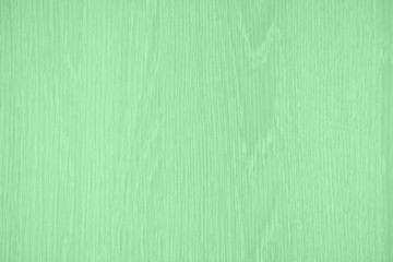 Trendy mint toned, low contrast wood texture background. Wavy textured plywood, a lot of fiber and small chips, close-up abstract tree background for design, decor and skins. Color of the year 2020.