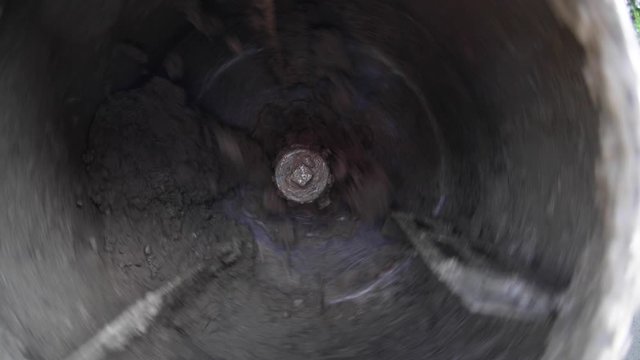 Concrete mixer drum while making the mix. middle