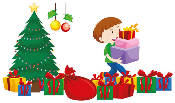 Boy with present boxes under christmas tree