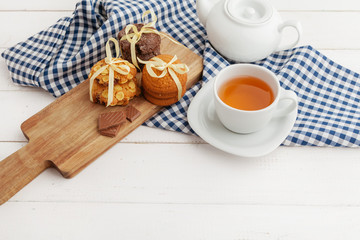 Homemade crunchy cookies and  tea on a wooden table