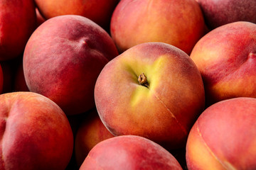Fototapeta na wymiar Many ripe sweet peaches, closeup