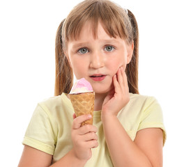 Little girl with sensitive teeth and cold ice-cream on white background