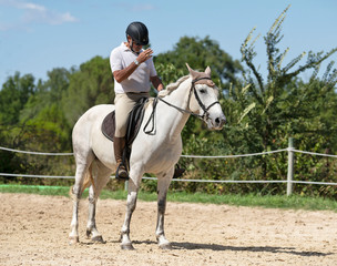 Fototapeta premium riding man and horse