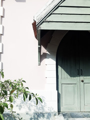 The vintage style concept of the background of the building wall with doors and trees is an element, the architecture of the building that blends perfectly with the composition of the picture
