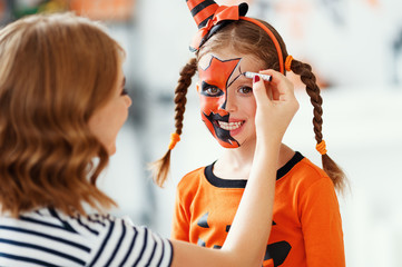 happy family  getting ready for halloween make make-up.