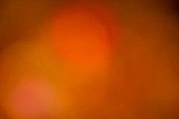 Background of blurred red color with circles