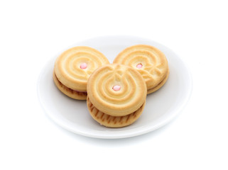 sandwich cookies with strawberry cream on white background