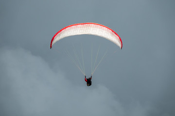 Paraglider in flight with the sky in background