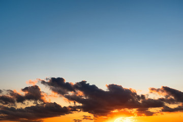 Bright colorful sunset, yellow blue and orange tones.