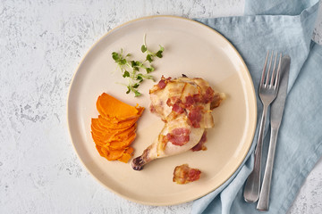 Chicken leg with batata and bacon, fodmap keto ketogenic diet, top view closeup