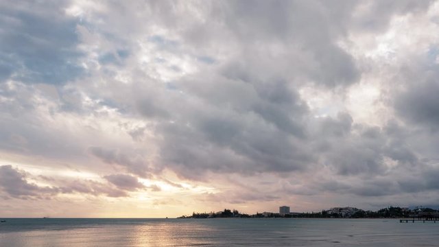 4k Timelapse video at the beach with mesmerizing clouds moving in the sky close to sunset at Anse Vata Bay in Noumea, New Caledonia - French Polynesia, South Pacific.