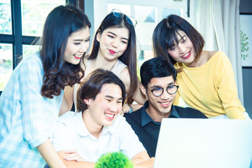 Teamwork business concept .Start up business people in modern office, working together having success. Multiethnic start-up business team on meeting in modern bright office interior brainstorming