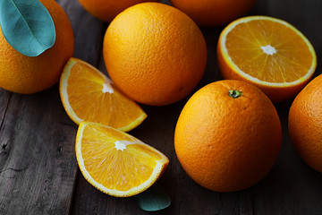 Orange citrus fruit on a stone table. Orange background.