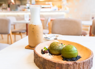 Ice cream green tea and Iced coffee in glass is on the table at modern cafe and restaurant in summer daylight