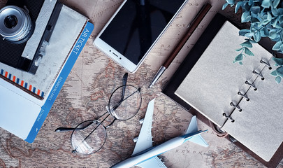 Travel concept. Map on the table andl aircraft.