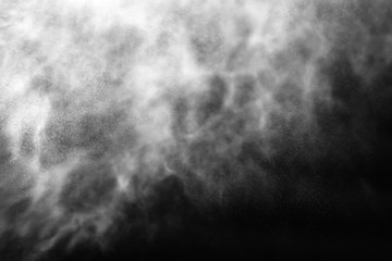 A stream of water and a cloud of drops