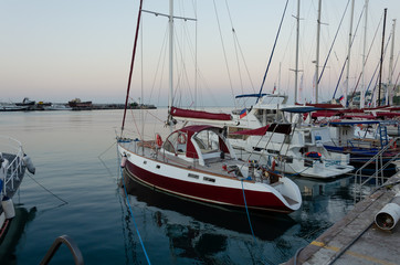 Fototapeta na wymiar Sea yachts near the pier in Yalta in the Crimea.