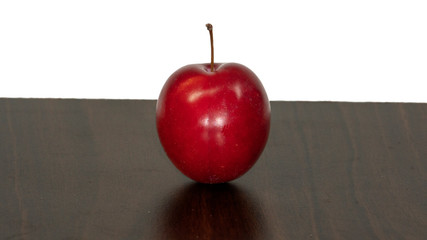 red appricot with white background and chopping board