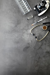 Vaccination. Disposable syringes and test tubes with medicinal vaccines on the table.