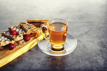 Sweet dessert with waffles and berries for tea at work.