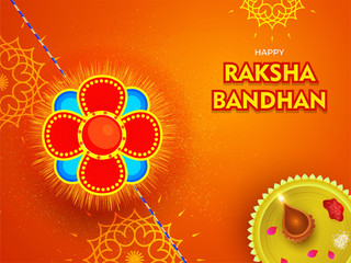 Beautiful Rakhi (Wristband) with worship plate on orange floral background for Happy Raksha Bandhan festival card or poster design.