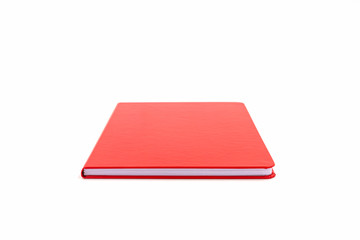Close up red leather notebook on white background.