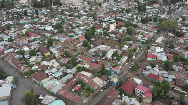 Flying backwards over residential and commercial district in Gondar, a mid sized town in Ethiopia