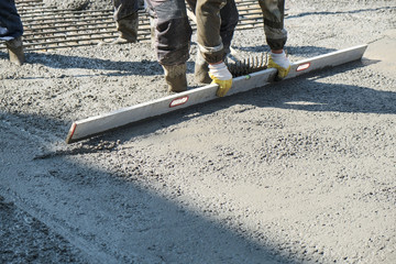 builders poured concrete at the construction site