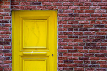 yellow door and orange brick wall in historic city Istanbul in Turkey