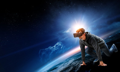 Fototapeta na wymiar Young man in virtual reality