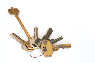 A bunch of modern door keys on ring on white background