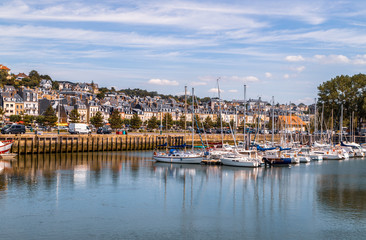 Fototapeta na wymiar Port of Deauville and city skyline in a sunny summer day, Normandy, France.
