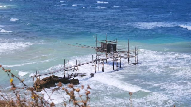 aerial Trabocchi coast in Vasto Punta Aderci Abruzzo region big waves rough sea - trabucco is old fishing machine famous south italy strong wind sea